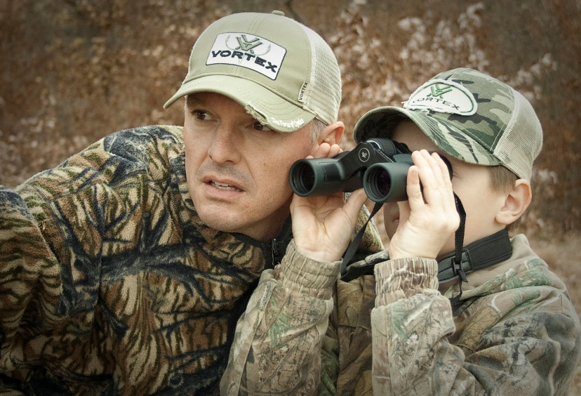 father and son with vortex binoculars